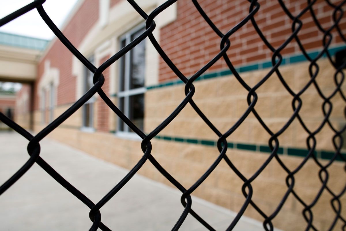 Building with Chain Link Fence — Bondurant, IA — Titan Fence LLC