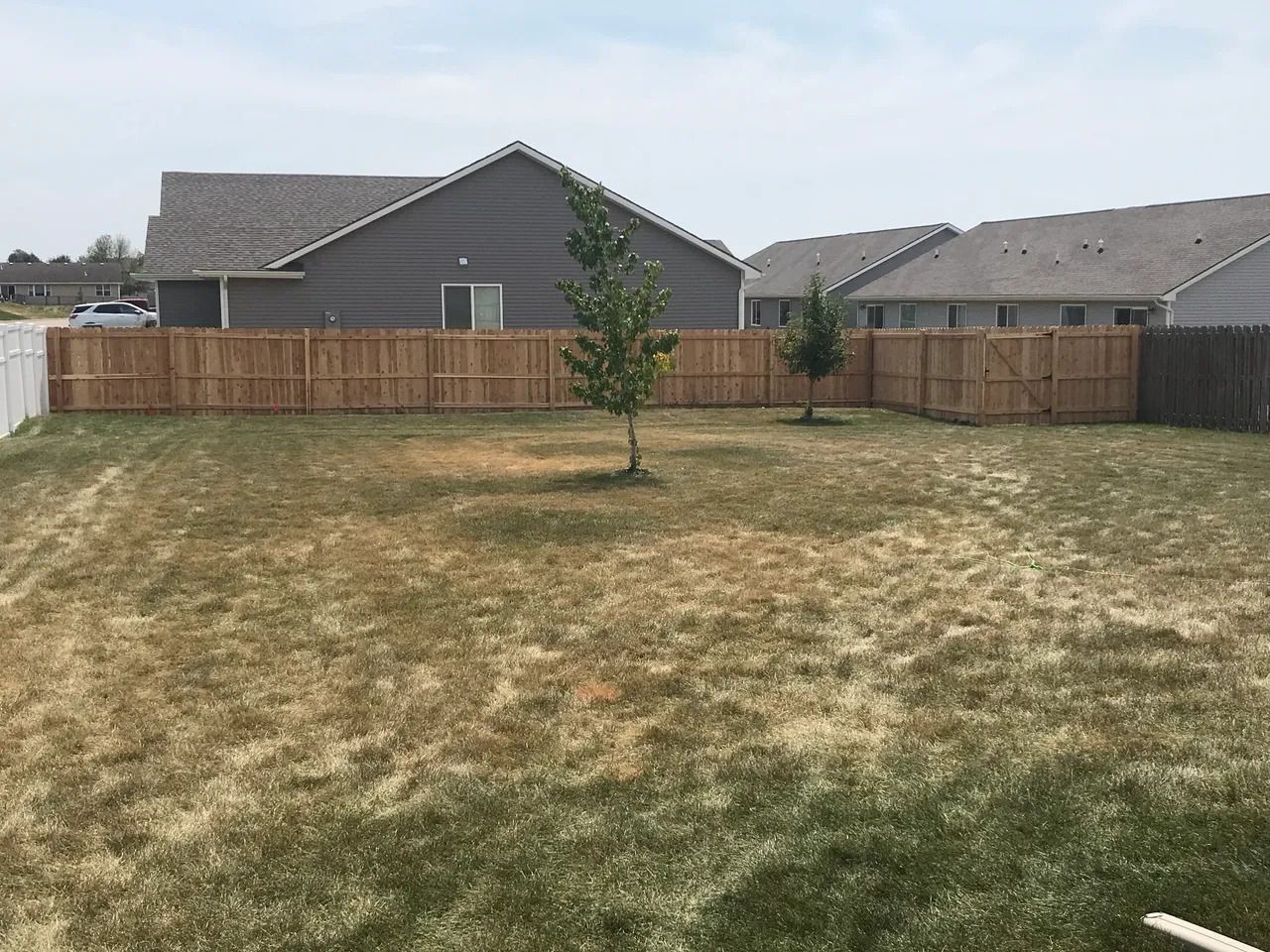 Backyard with a Wooden Fence — Bondurant, IA — Titan Fence LLC