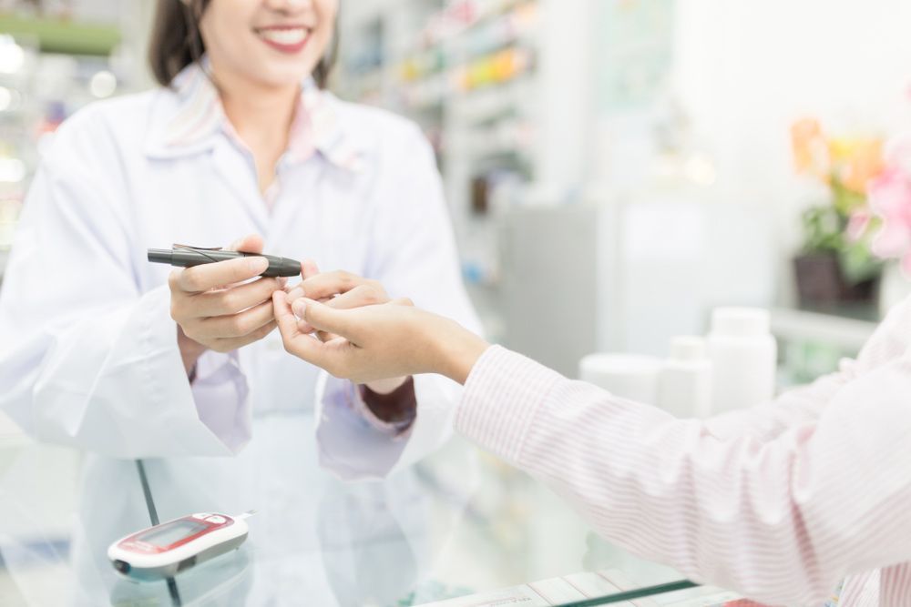 Healthcare Worker Use Glucometer Screening And Keep Blood Exam To Diabetic Screening — Diabetes Services in Wulguru, QLD