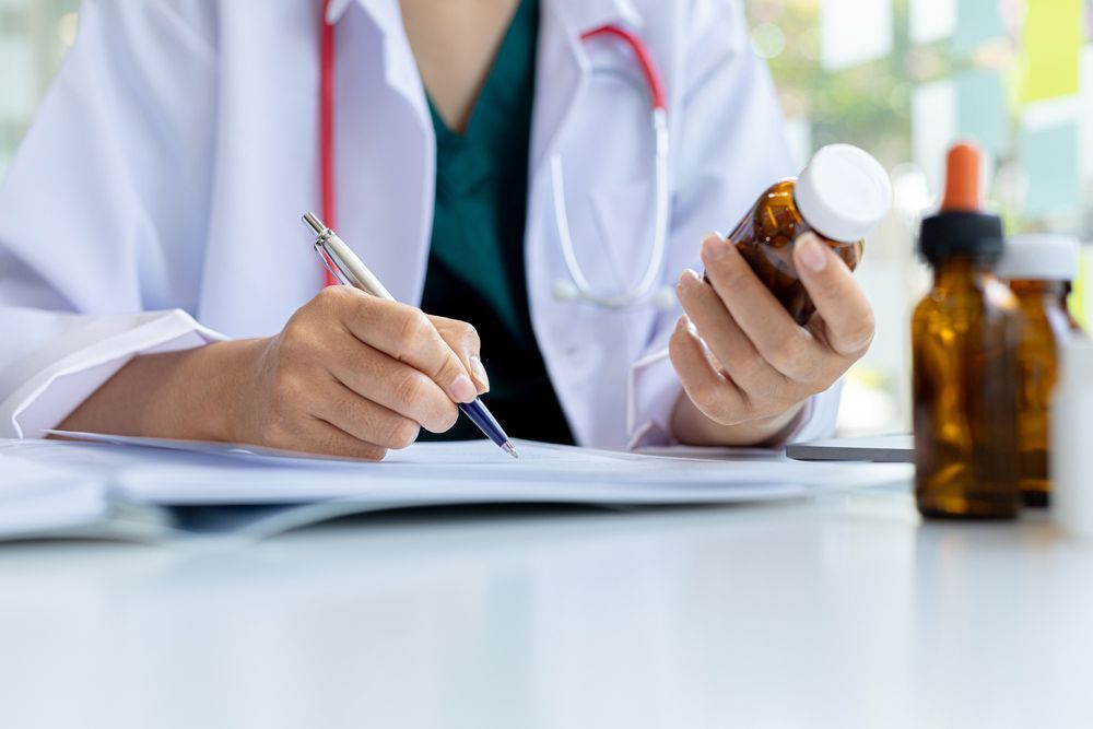 The Pharmacist Is Reviewing The List Of Drugs And Checking The Stock Of All Medicines At One Of The Pharmacies He Owns, His Home Pharmacy And Selling Medical Supplies — Home Medication Reviews in Wulguru, QLD