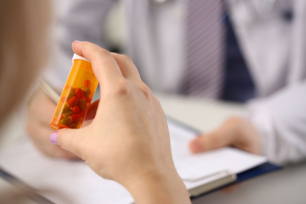 A Woman Hands With Medical Pills And Doctor — Personal Medication Packs in Wulguru, QLD