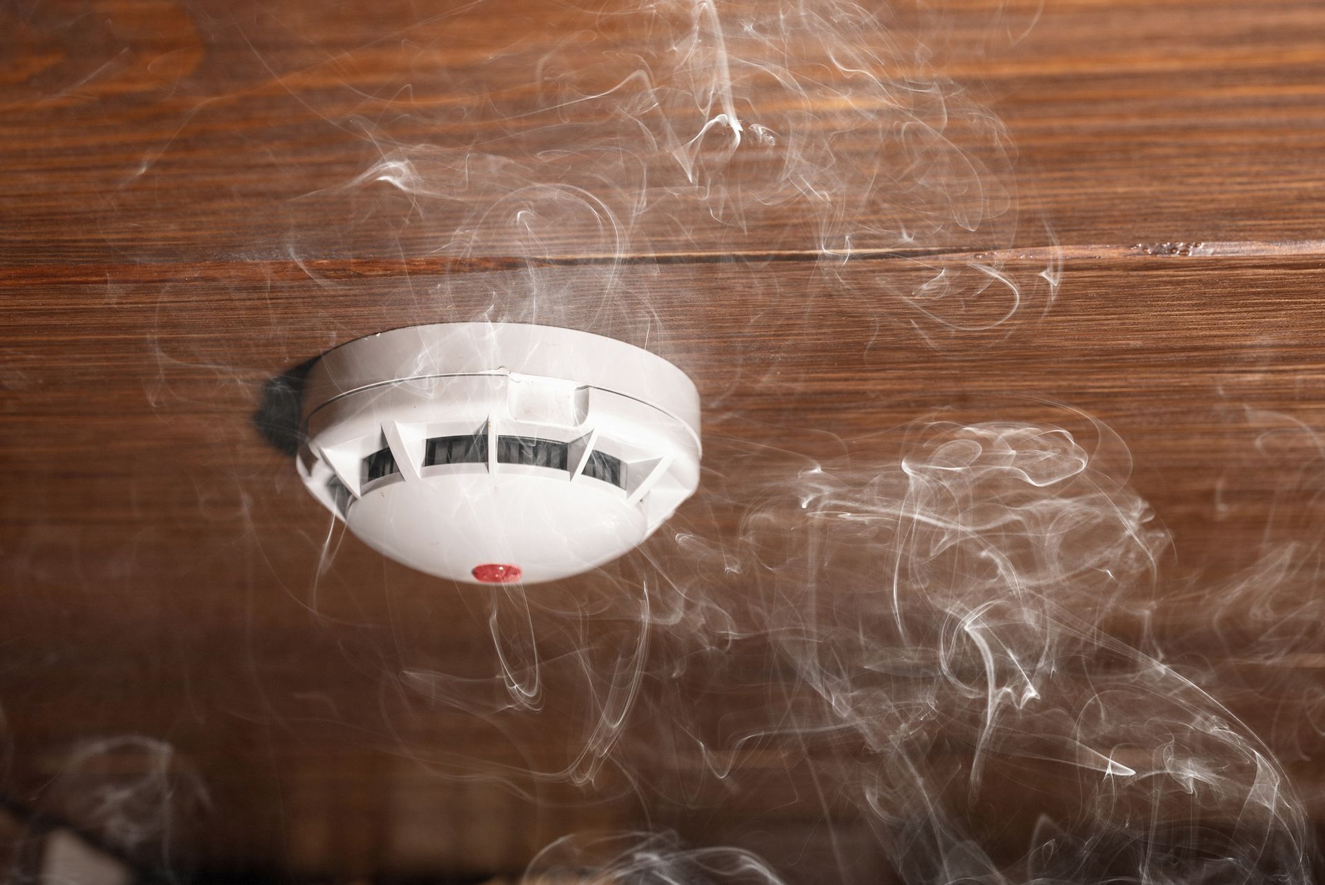 Ceiling-mounted Smoke Detector on a Wooden Ceiling — Anthony Cameron Electrical & Solar In Kepnock, QLD
