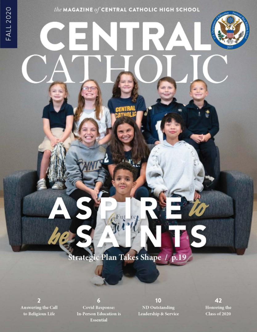 A group of children are sitting on a couch on the cover of central catholic magazine.