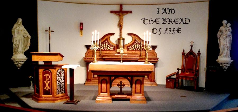 A church altar with a sign that says the bread of life
