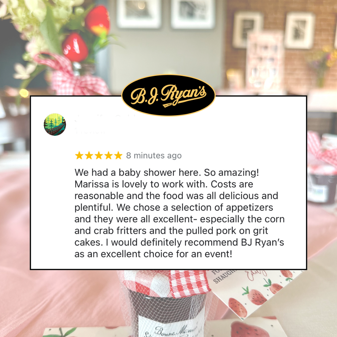 A glowing five-star review for B.J. Ryan's restaurant regarding a baby shower event, layered over a soft-focus table setting.