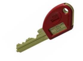 Key lockbox mounted on a tan stucco wall with the door open.— Yamba Locksmiths in Yamba, NSW