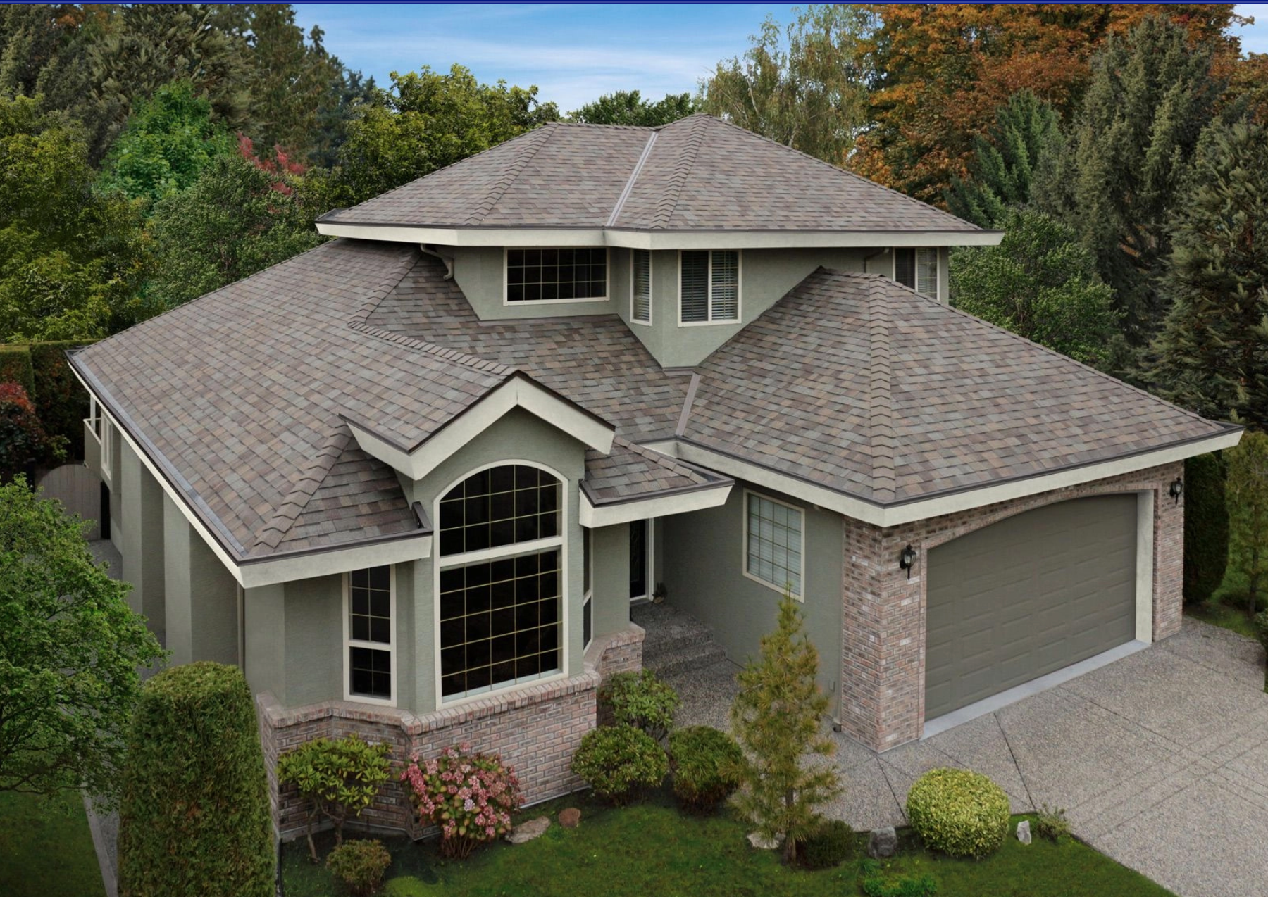 An aerial view of a large house with a gray roof