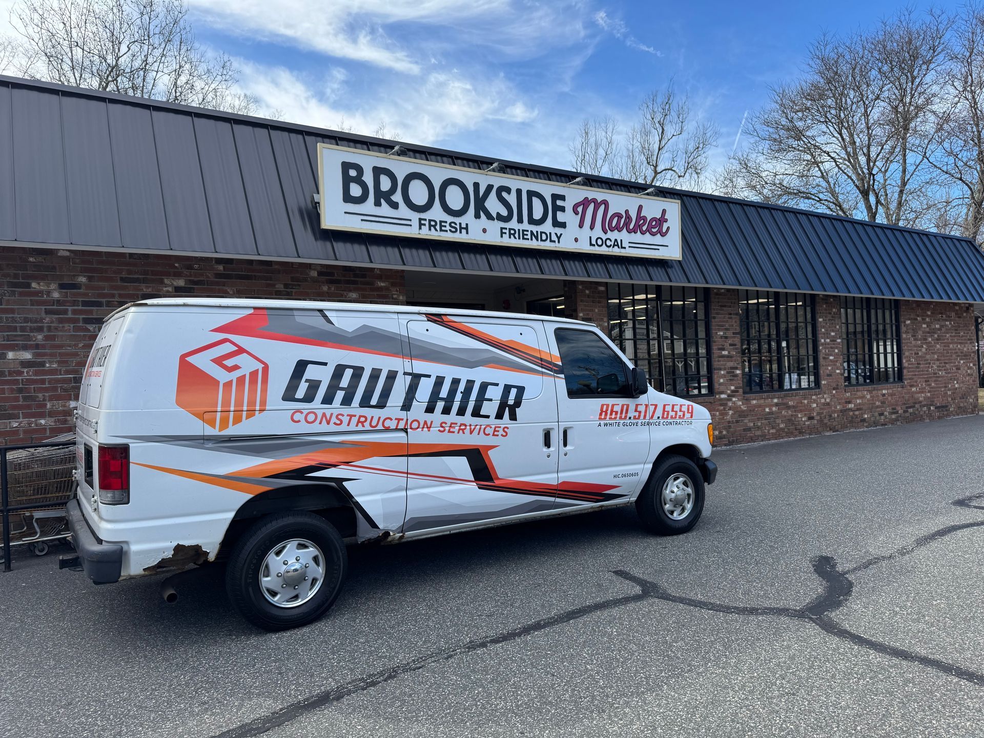 White van with Gauthier Construction Services parked in front of Brookside Market.