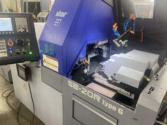 Blue and gray SB-20R type G machine with control panel in a manufacturing setting.