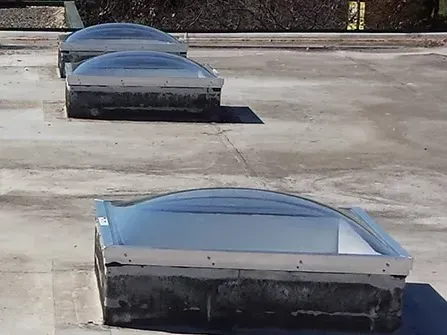 A row of skylights on the roof of a building