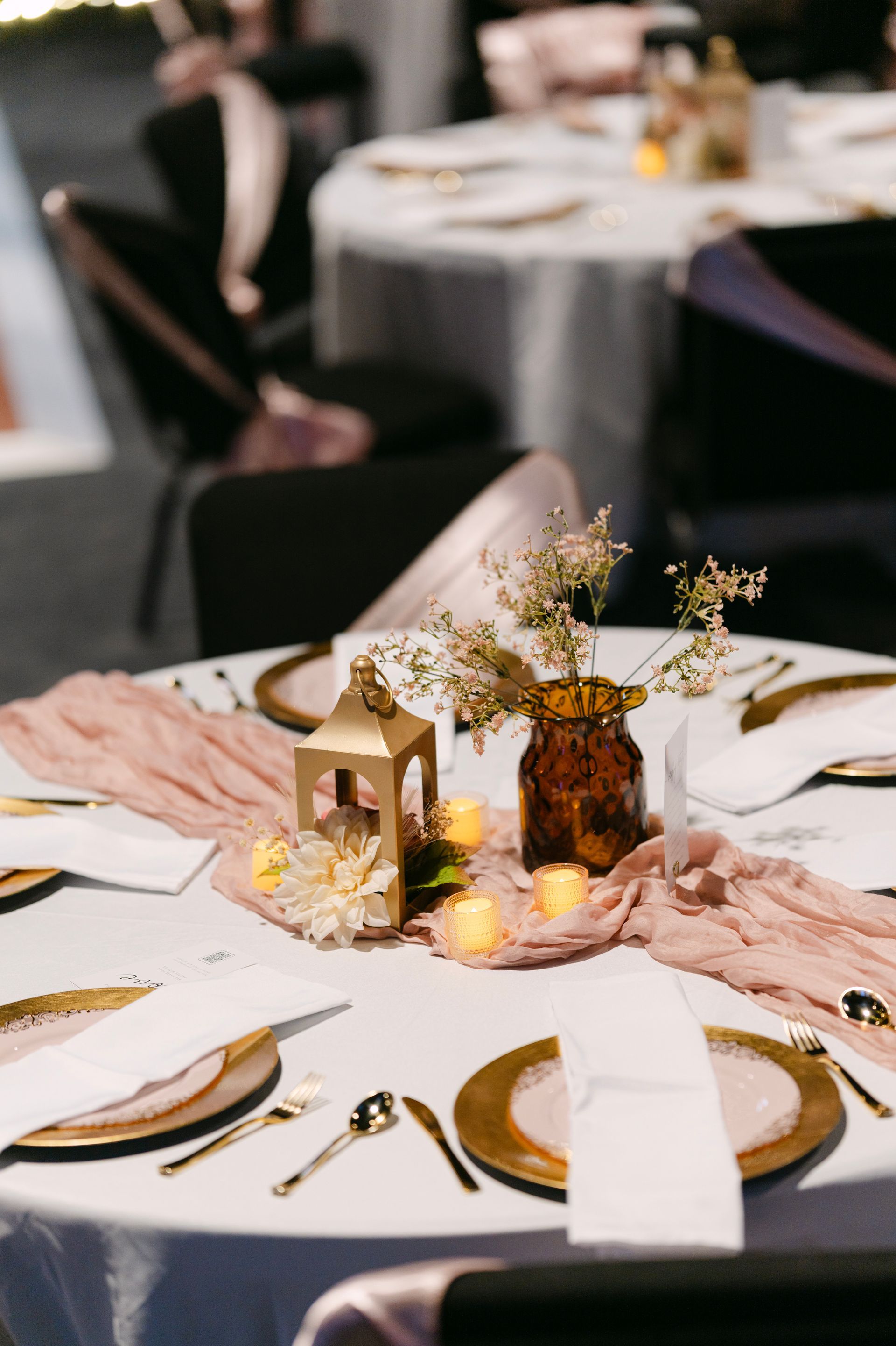 Wedding reception table setting with gold accents and blush-colored runner.
With Love, Wedding management, Milwaukee Wedding Coordinator