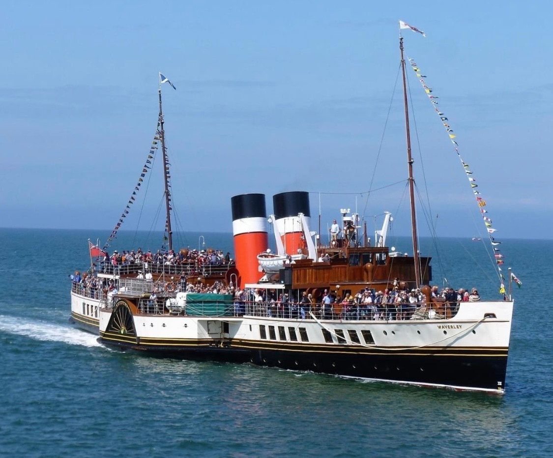 A large ship is floating on top of a body of water