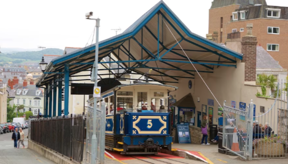 A blue train with the number 5 on the side of it