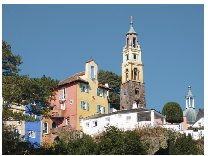 A colorful village with a clock tower in the middle