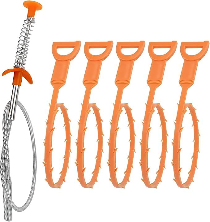A set of four orange drain cleaners on a white background