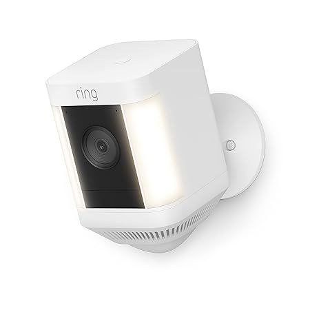 A white ring security camera with a light attached to it.