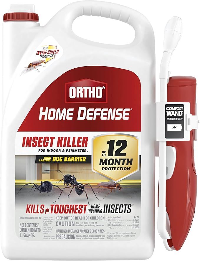 A bottle of ortho home defense insect killer with a pen attached to it.
