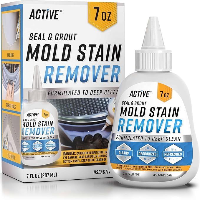 A bottle of active mold stain remover next to a box.