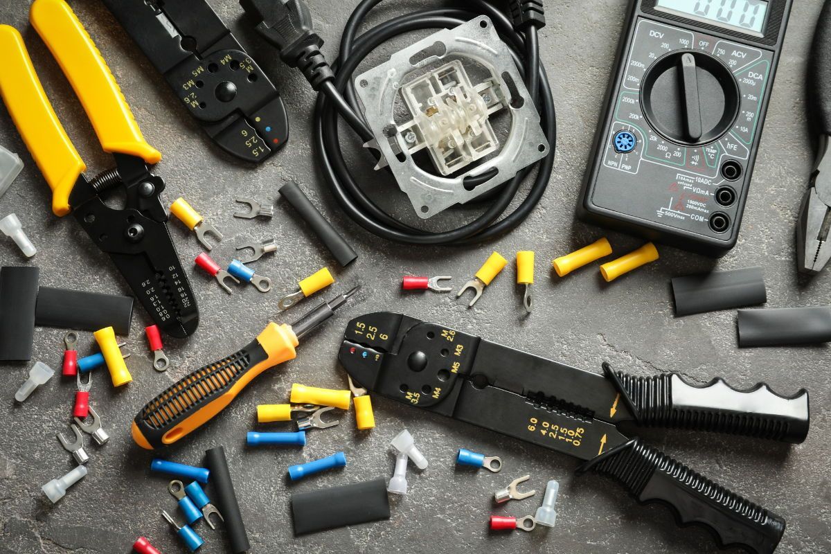There are many different types of electric tools on the table.