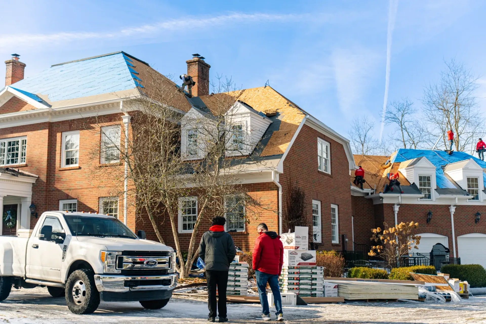 roof contractor outside of home during a roof replacement