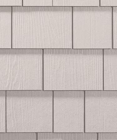 Light gray shingle-style wall with vertical grooves and staggered rectangular panels