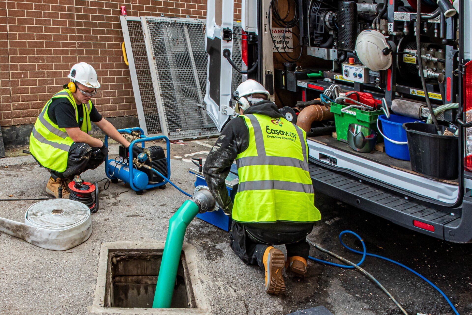 drainage engineers working on a drain