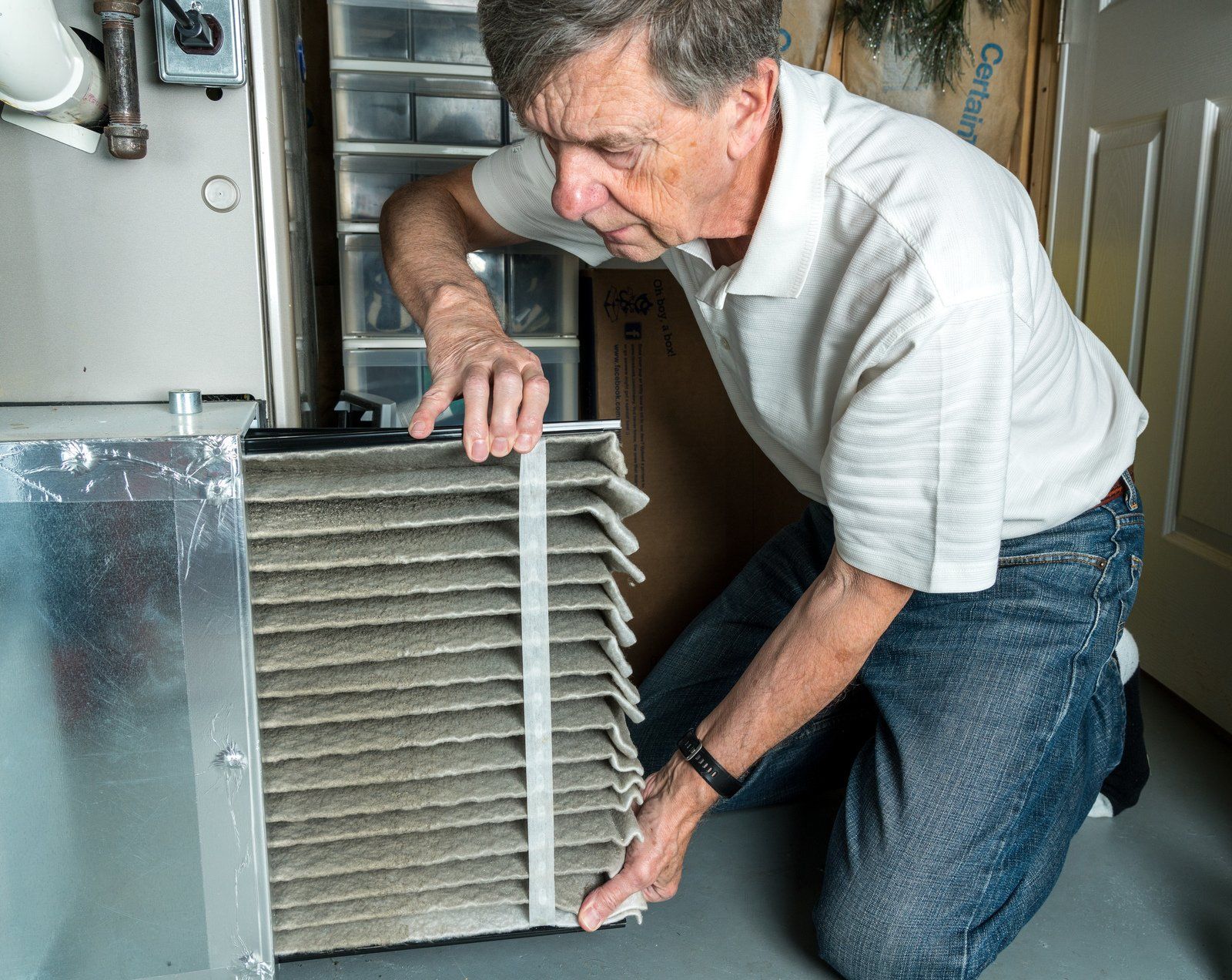 man checking/cleaning the filter