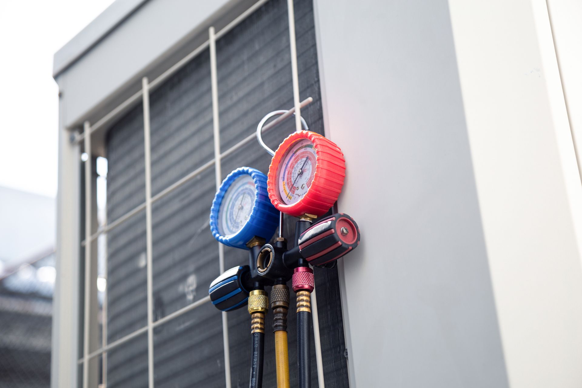 HVAC technician repairing a central air conditioning unit outside a home in Deltona, Florida.