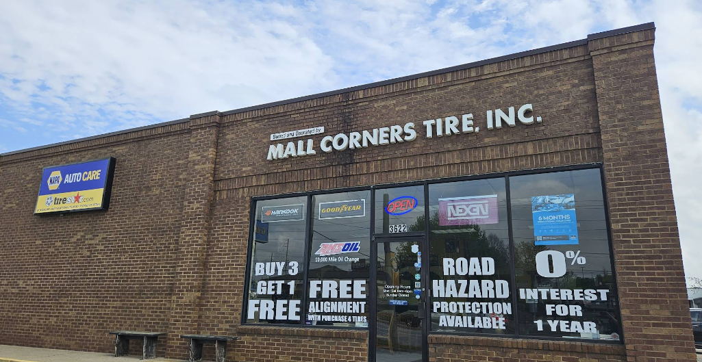 Storefront of Mills Corners Tree, Inc. with brick exterior and bold white signage.