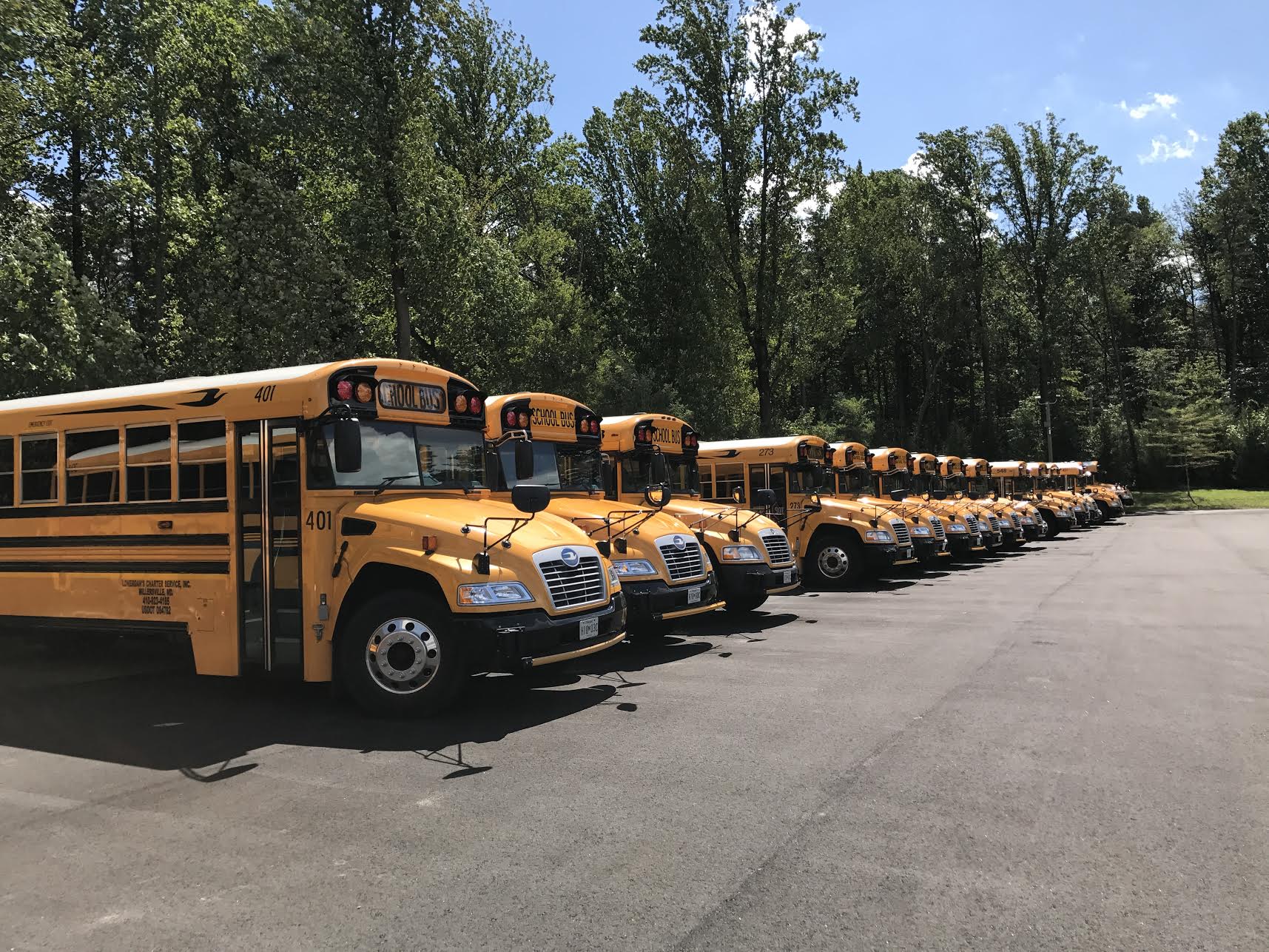 Charter Bus — Buses in Parking Lot in Millersville, MD Charter Bus — Buses in Parking Lot in Millersville, MD