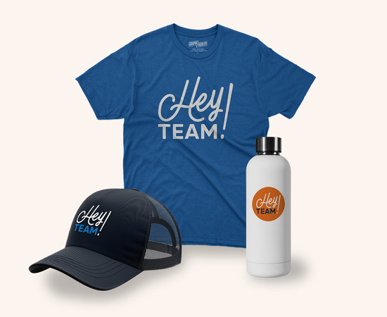 A blue t-shirt, a black mesh cap, and a white water bottle, all branded with the logo