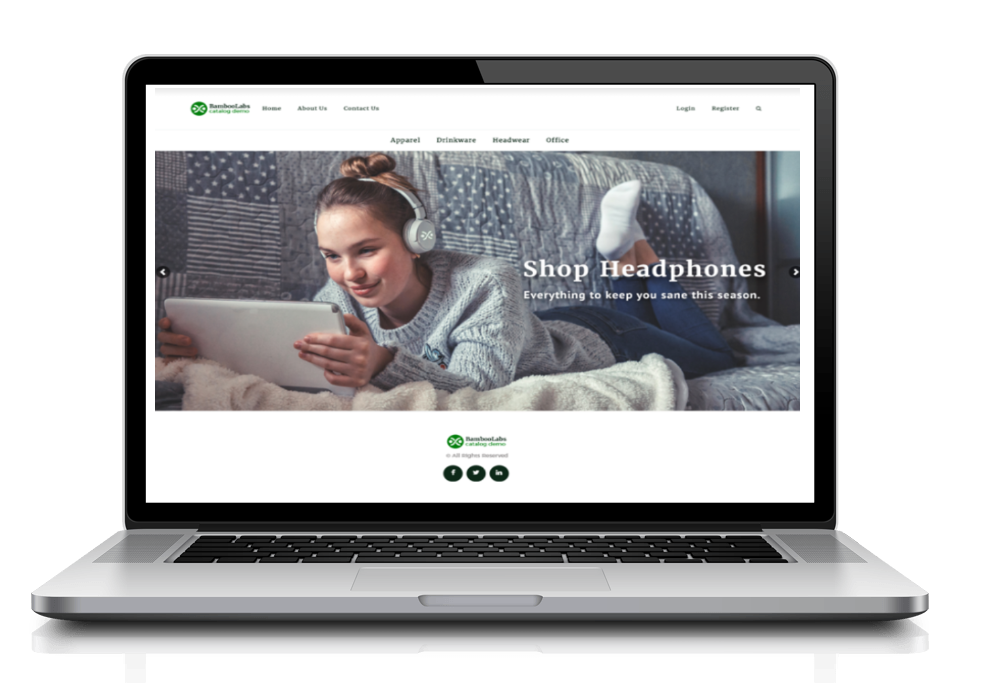 A laptop displays a website home page featuring a person wearing headphones while using a tablet on a couch.