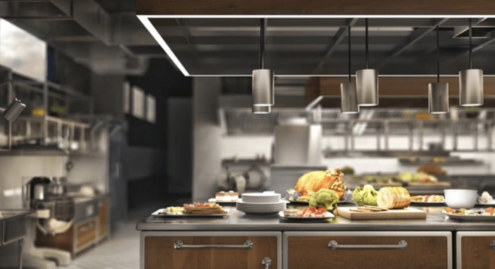 A kitchen with a lot of food on the counter.