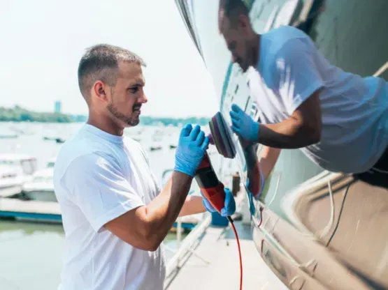 a man polishing a boat