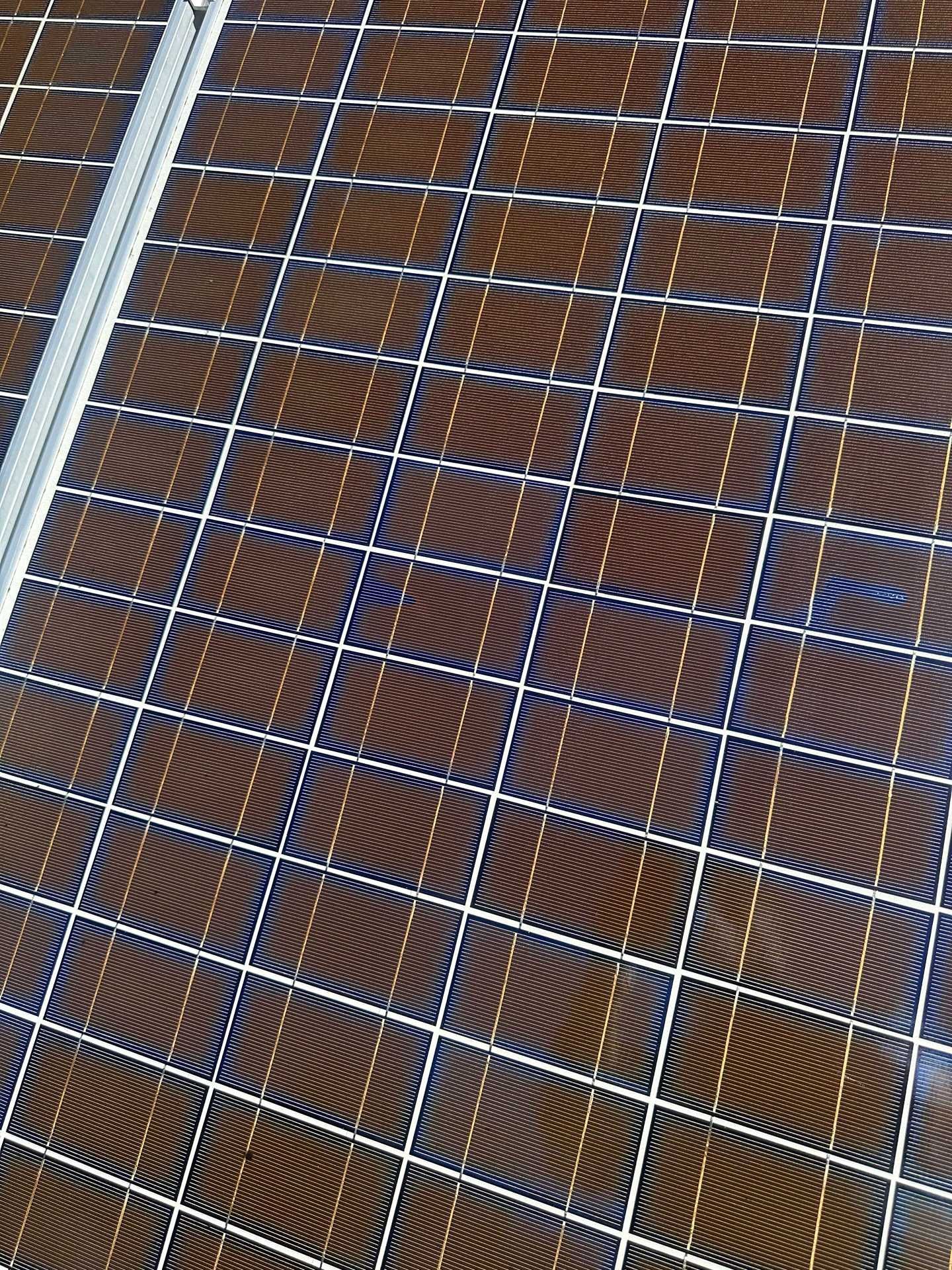 Close-up of a brown woven mesh or lattice pattern with white diagonal lines across it.