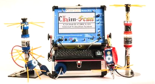 Miniature electrical gadget display with a central screen and colorful spinning components on both sides