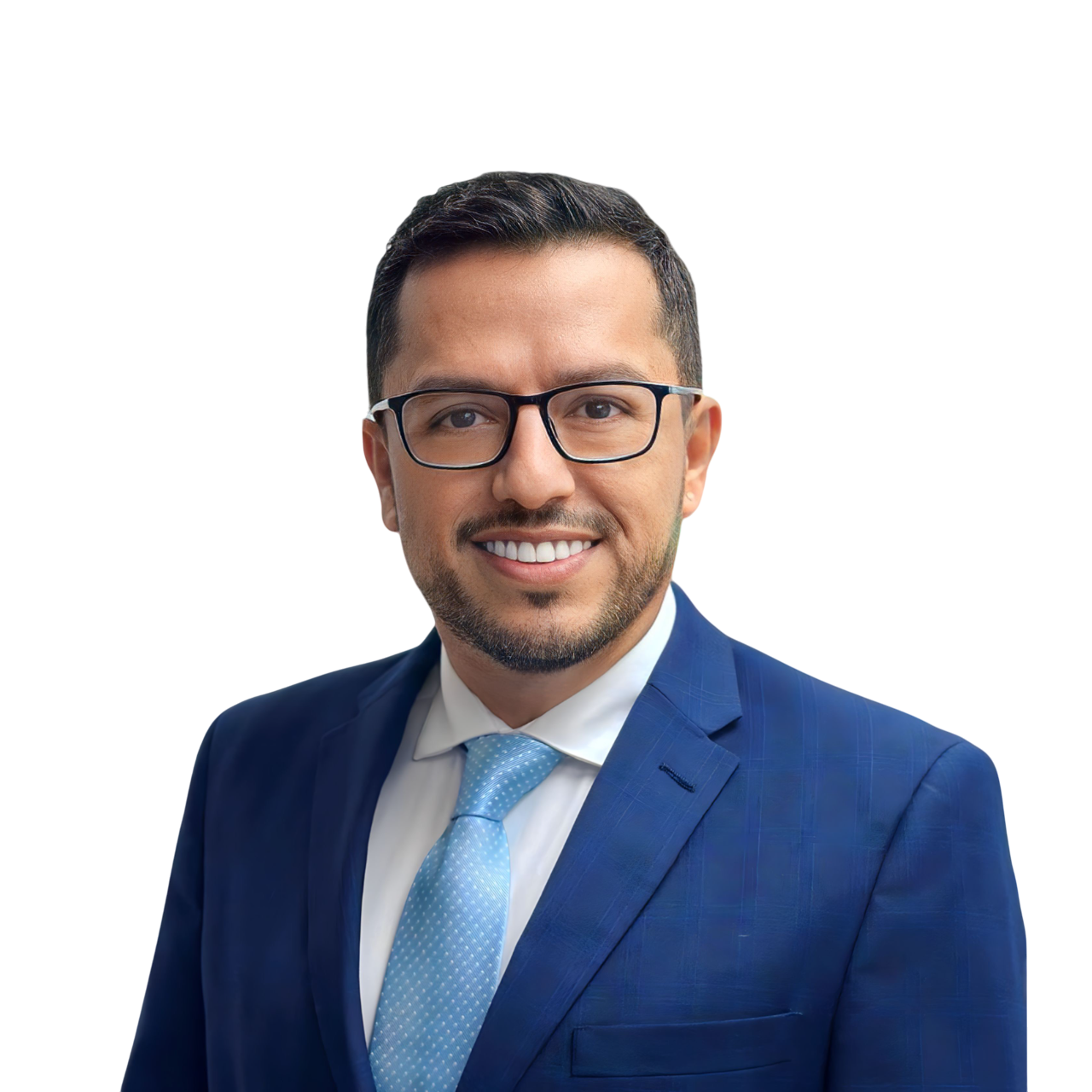 Professional headshot of owner in a blue suit, white shirt, and light blue tie, smiling.