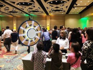Wheel of fortune draws young crowd for a Mitzvah event. 