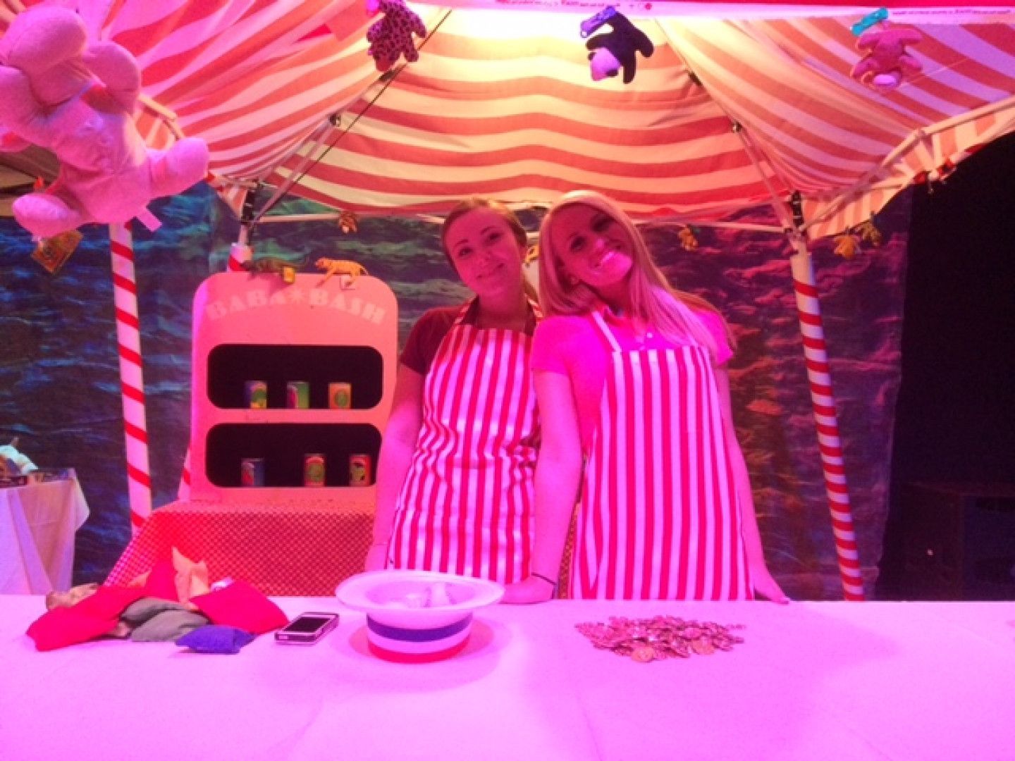 Carnival game attendants create fun for the guests 