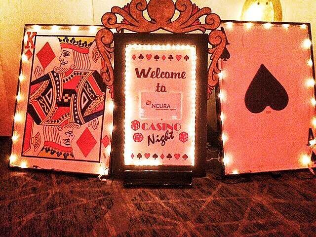 Card cutouts and marquee to accent your casino night. 