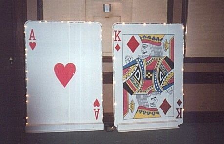 Two playing cards props with the ace of hearts and the king of diamonds