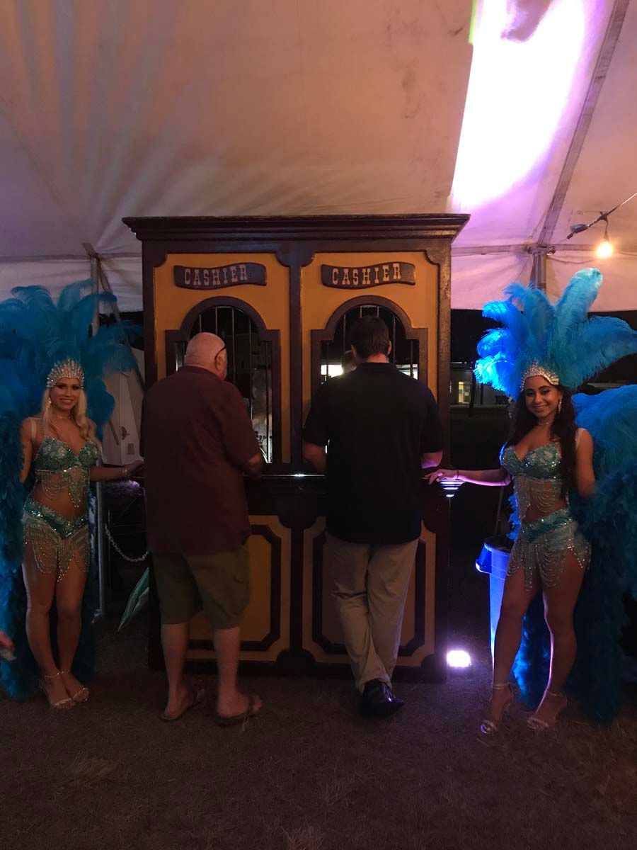 Showgirls at a western theme casino night.