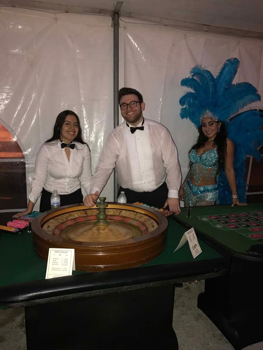 roulette croupiers and showgirls at a corporate event.