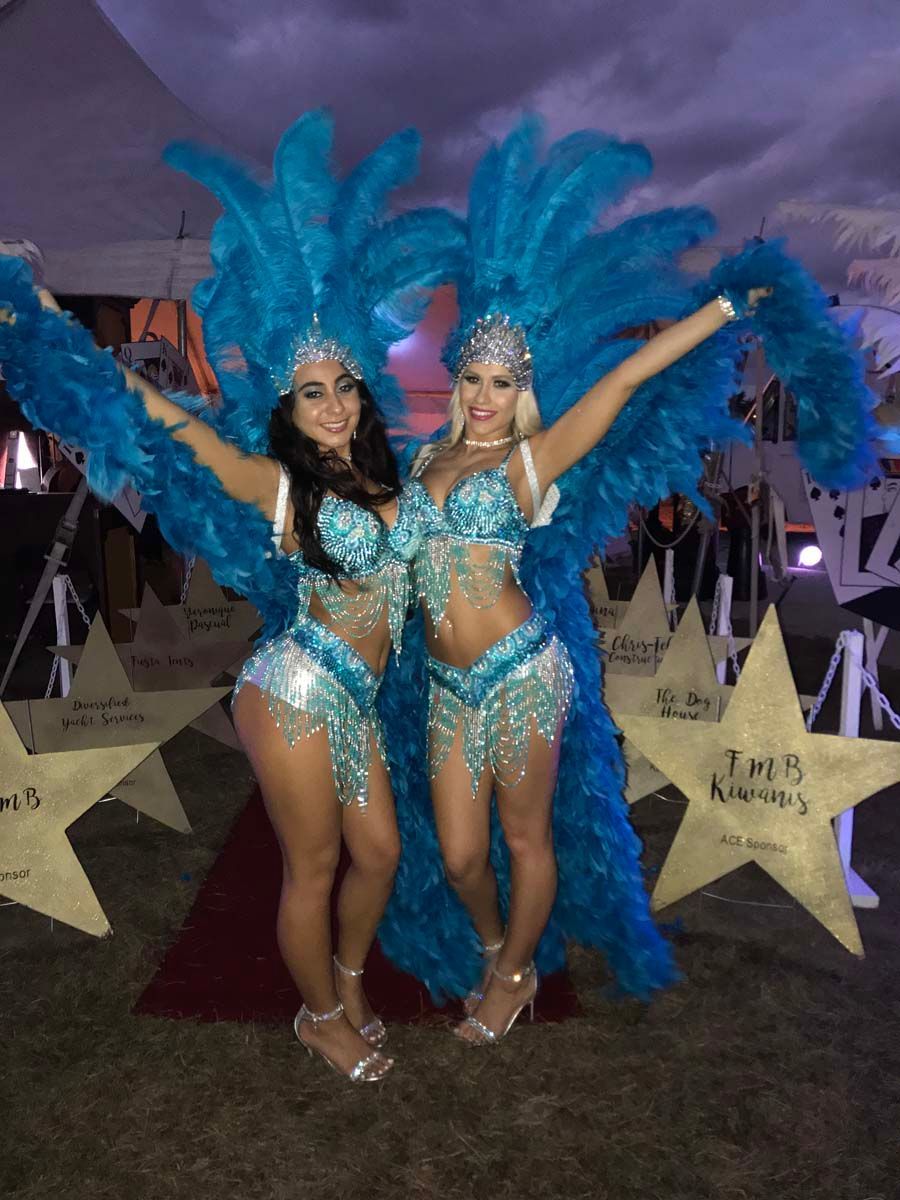 Showgirls greeting guests at a Monte Carlo night.