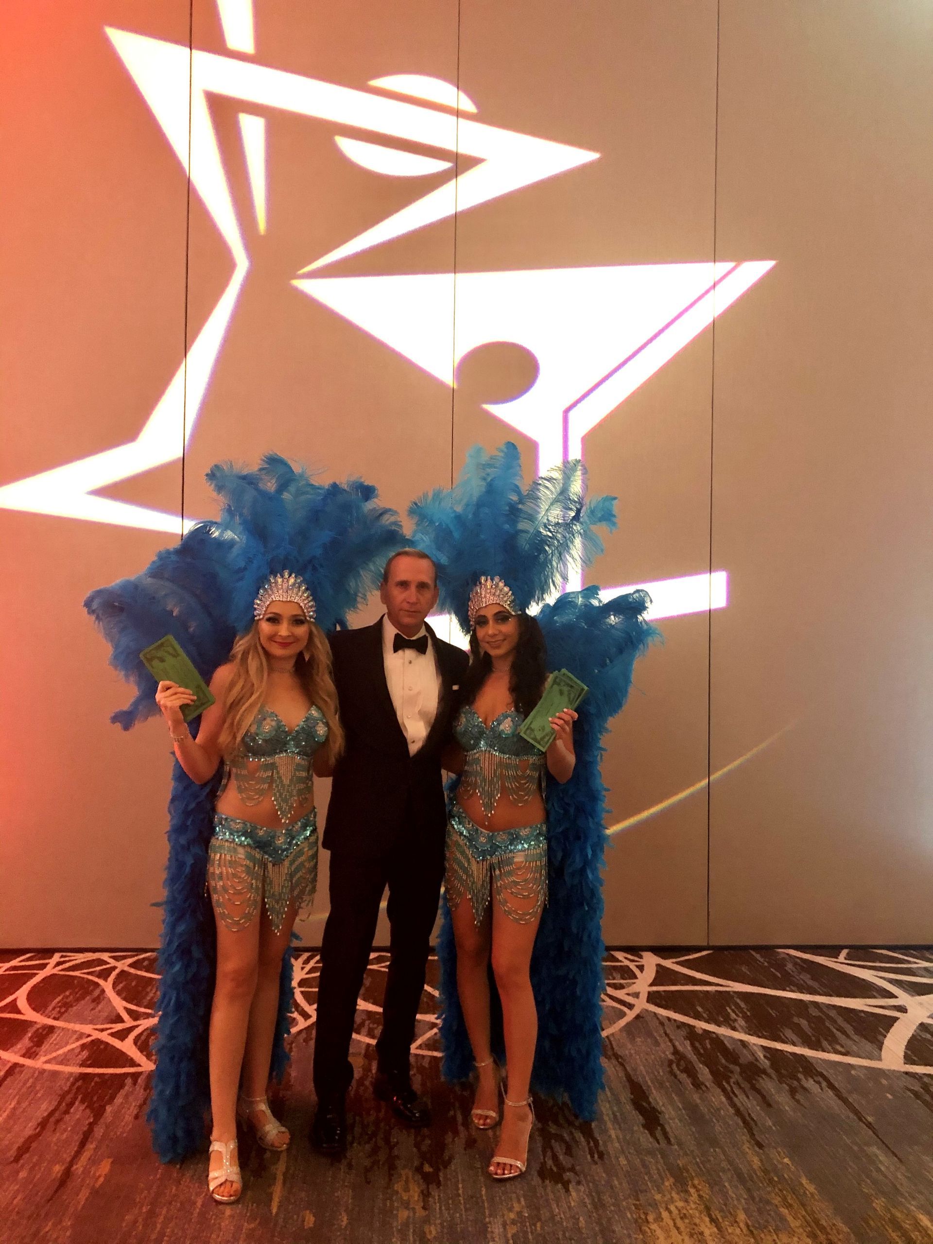 Showgirls and James Bond in front of custom gobos.
