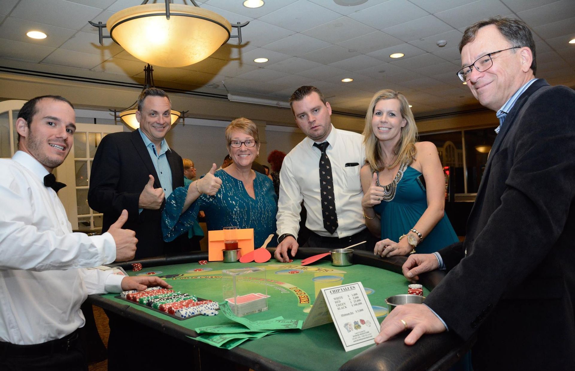 Everybody having a good time at a casino night. 