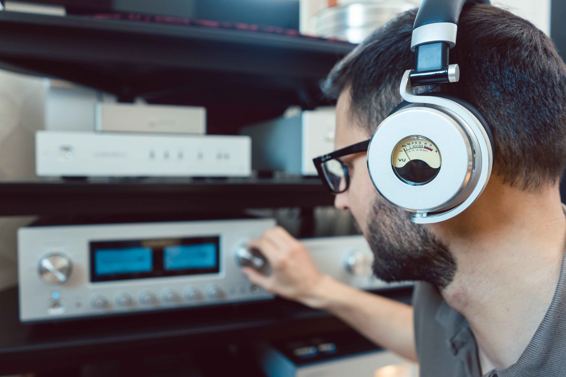 Man adjusting the volume of the sound system