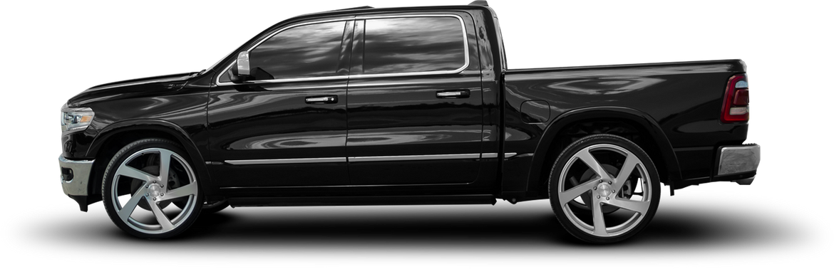 Black pickup truck with chrome rims.