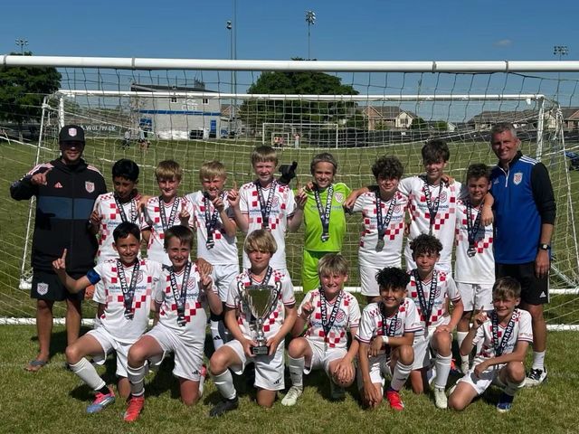 Croatian Eagles Soccer Club team with a trophy