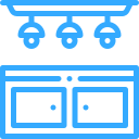 Blue ceiling track lights above a blue double-door cabinet with round handles